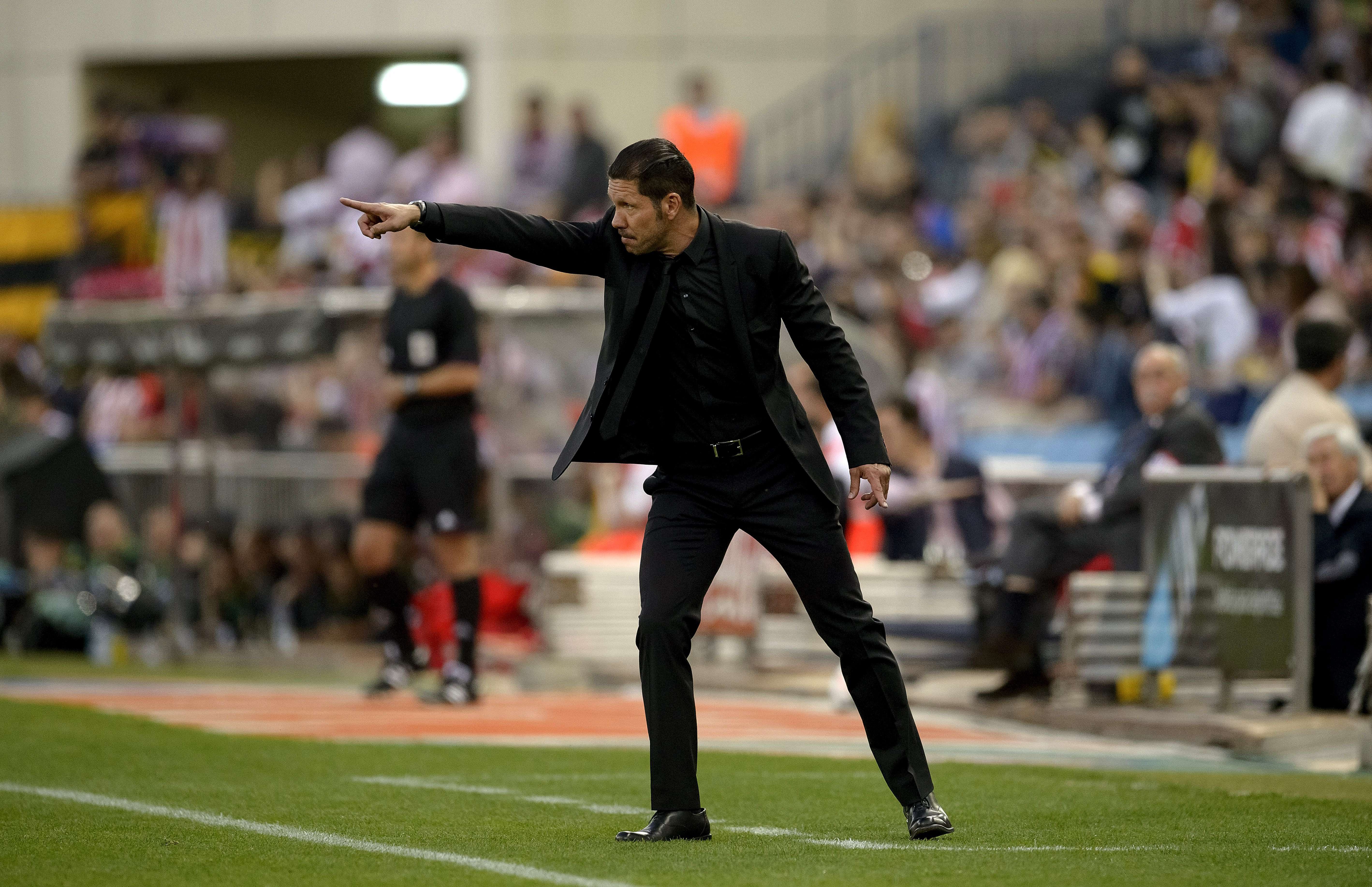 Atletico Madrid's Argentinian coach Diego Simeone gestures during the Spanish league football match Club Atletico de Madrid vs Elche CF at the Vicente Calderon stadium in Madrid on April 18, 2014. AFP PHOTO/ DANI POZODANI POZO/AFP/Getty Images@@DV1707650.jpg