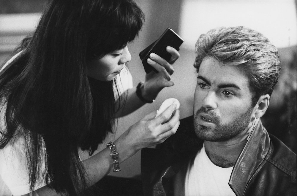 English singer and songwriter George Michael (1963-2016) pictured receiving attention from a make up artist prior to appearing at a press conference during the Japanese/Australasian leg of his Faith World Tour, February-March 1988. (Photo by Michael Putland/Getty Images)